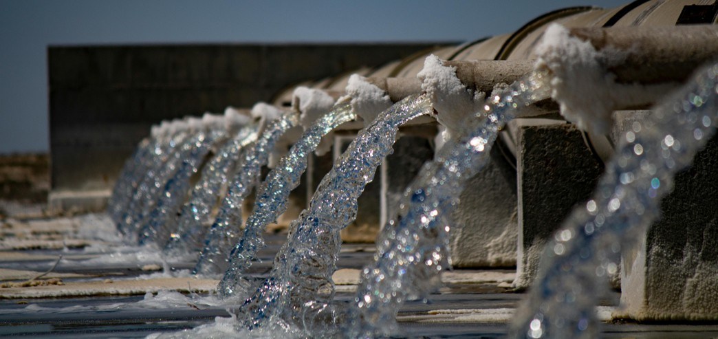Treated water discharging from a row of outlet channels