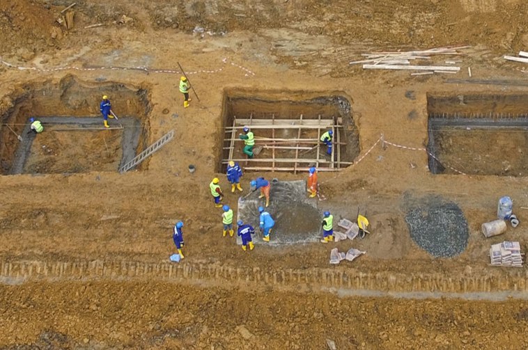 Aerial view of foundation excavation and reinforcement works